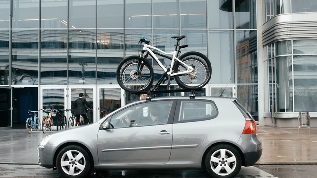 Video Reference: motor vehicle, car, vehicle, automotive design, wheel, building, rim, volkswagen, automotive wheel system, automotive tire, Person