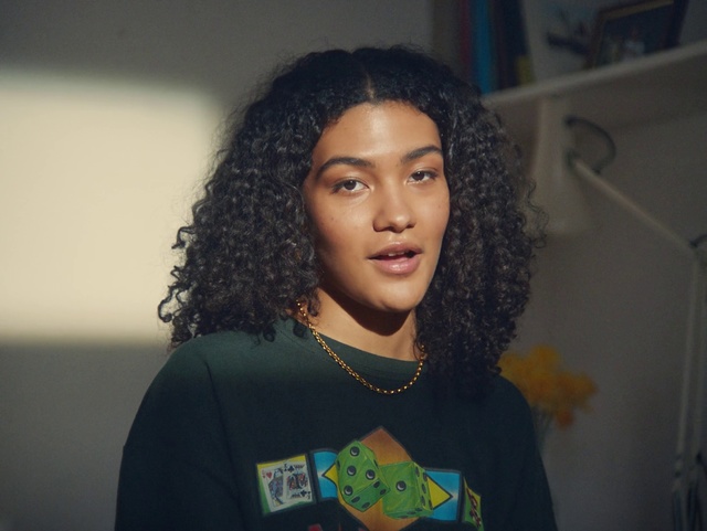 Video Reference: Hair, Face, Hairstyle, Eyebrow, Head, Forehead, Black hair, Jheri curl, Human, Long hair