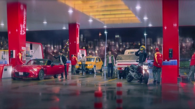 Video Reference: Red, Vehicle, Filling station, Car, Building, Gasoline, Business, Luxury vehicle, Auto show, Auto part