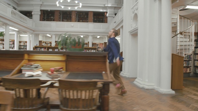 Video Reference: furniture, lobby, library, interior design, flooring, table