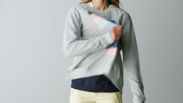 Video Reference: Clothing, White, Sleeve, Outerwear, Sweater, Shoulder, Neck, Top, Cardigan, Jacket, Person