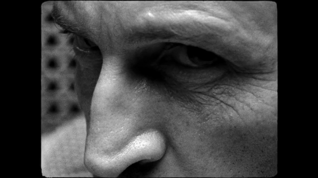 Video Reference: Face, Nose, Skin, Photograph, Wrinkle, Facial expression, Close-up, Cheek, Head, Black-and-white