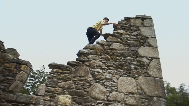 Video Reference: Wall, Rock, Stone wall, Ruins, Bedrock, Outcrop, Temple, Ancient history, Person