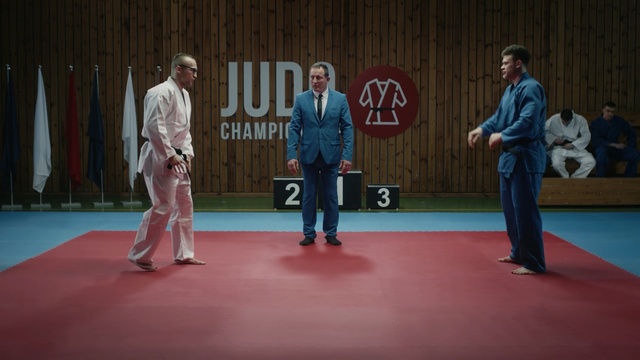 Video Reference: Dobok, Martial arts, Photograph, Judo, Blue, Sport venue, Red, Jujutsu, Sports, Social group, Person