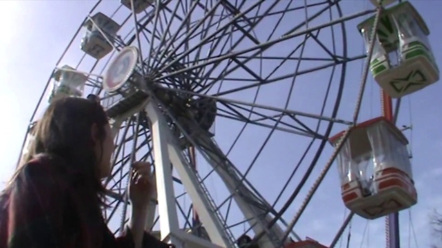 Video Reference: Sky, Ferris wheel, Outdoor recreation, Wheel, Automotive wheel system, Leisure, Recreation, Fun, Amusement ride, Spoke