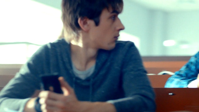 Video Reference: blue, girl, sitting, electronic device, fun, communication, conversation, student, smile, Person