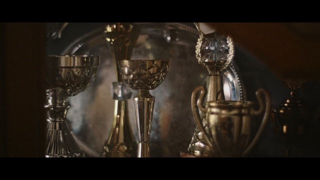 Video Reference: Lighting, Light fixture, Still life photography, Chandelier, Metal, Darkness, Glass, Drinkware, Person