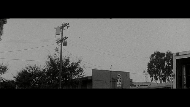 Video Reference: sky, black, black and white, electricity, tree, urban area, monochrome photography, residential area, atmosphere, architecture
