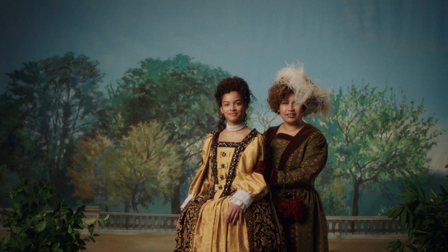 Video Reference: Photograph, Lady, Photography, Fun, Visual arts, Adaptation, Screenshot, Dress, Art, Portrait, Person, Outdoor, Standing, Woman, Man, Front, Holding, Young, Yellow, Living, Phone, Shirt, Room, Tree, Clothing, Human face, Painting, Smile