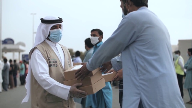 Video Reference: Sky, Greeting, Handshake, Gesture, Cap, Government agency, Baseball cap, Event, Personal protective equipment, Belt