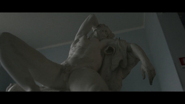 Video Reference: sculpture, organism, mouth, statue, screenshot, jaw, art, fictional character, monument, wing, Person