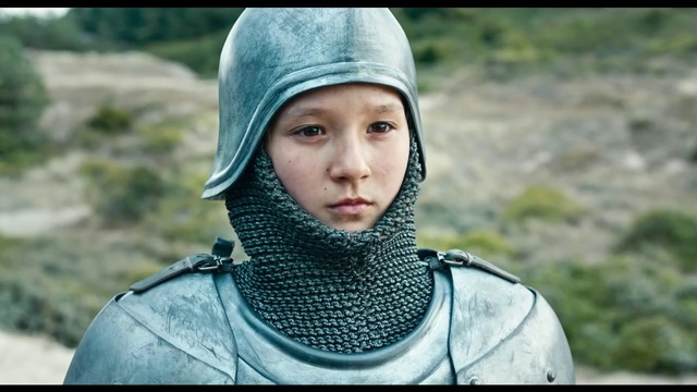 Video Reference: Head, Human, Headgear, Neck, Adaptation, Smile, Screenshot, Person, Outdoor, Clothing, Grass, Little, Boy, Wearing, Small, Young, Smiling, Jacket, Child, Green, Camera, Hat, Holding, Standing, Park, Uniform, Riding, Blue, Man, Bench, White, Dog, Field, Human face, Toddler, Face, Fashion accessory, Scarf, Girl, Armor