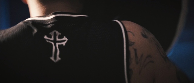 Video Reference: black, shoulder, joint, darkness, hand, arm, tattoo, muscle, finger, neck, Person