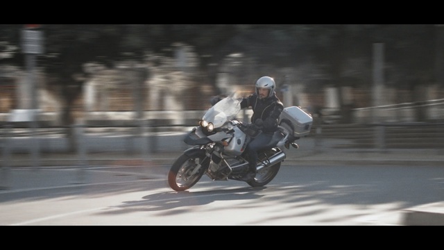 Video Reference: land vehicle, motorcycle, vehicle, car, mode of transport, motorcycling, stunt, stunt performer, personal protective equipment, racing