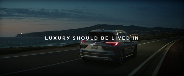 Video Reference: Land vehicle, Vehicle, Car, Automotive design, Mid-size car, Performance car, Crossover suv, Compact car, Infiniti, Outdoor, Road, Scene, Sunset, Highway, Street, Sign, Driving, Traffic, Red, Side, Cloudy, Dark, Parked, Mountain, Light, Stop, Riding, Motorcycle, Water, Sky, Way, Wheel, Automotive, Text, Auto part, Vehicle registration plate