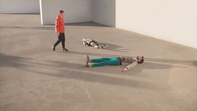 Video Reference: Floor, Flooring, Concrete, Racquetball, Game, Sport, Person, Riding, Man, Jumping, Board, Young, Trick, Park, Ramp, Doing, Air, Boy, Wearing, Hill, Playing, Holding, Slope, Water, Skateboard, Flying, White, Snow, Standing, Court, Skating, Footwear, Ground, Athletic game, Clothing