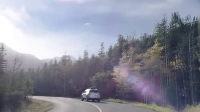 Video Reference: Road, Nature, Atmospheric phenomenon, Mode of transport, Thoroughfare, Asphalt, Geological phenomenon, Mountain pass, Hill station, Highland