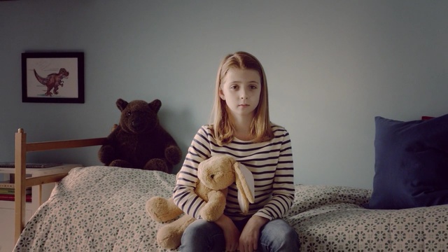 Video Reference: mammal, room, vertebrate, sitting, girl, cat, textile, furniture, product, carnivoran, Person