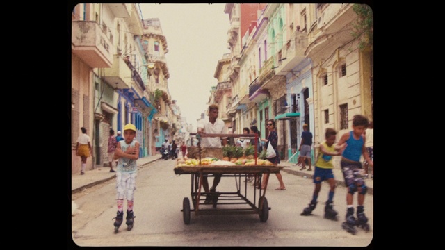 Video Reference: Town, Neighbourhood, Street, Mode of transport, Snapshot, Table, Human settlement, Urban area, Fun, Furniture