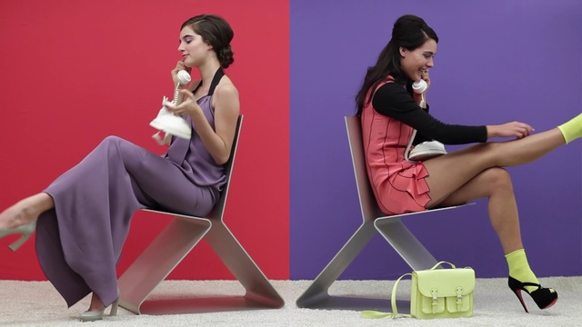 Video Reference: footwear, sitting, leg, shoe, furniture, shoulder, human leg, thigh, joint, muscle, Person