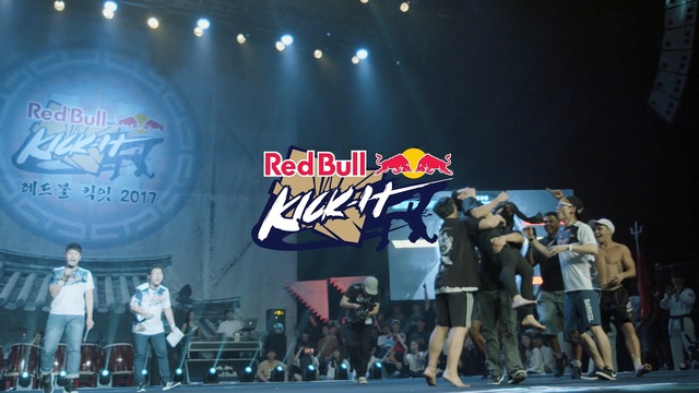 Video Reference: stage, red bull, entertainment, performance, competition, product, crowd, sport venue, drink, concert