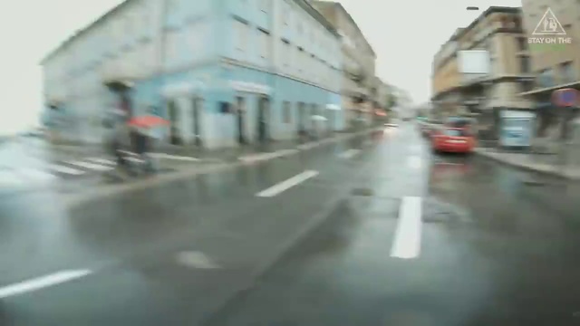 Video Reference: Building, Road surface, Automotive lighting, Fixture, Asphalt, Window, Automotive exterior, Sky, Windscreen wiper, Urban design