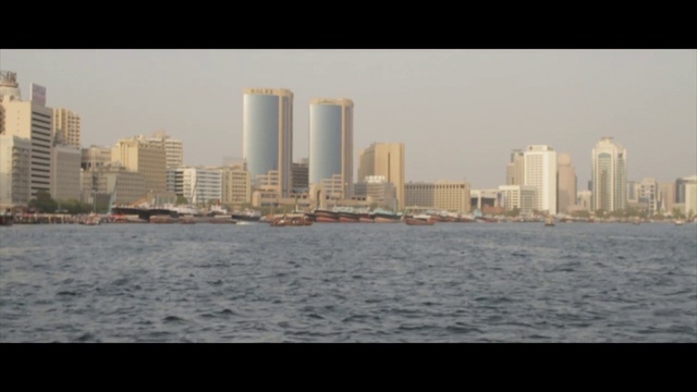Video Reference: City, Skyline, Cityscape, Metropolitan area, Skyscraper, Metropolis, Daytime, Urban area, Human settlement, Water