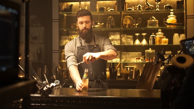 Video Reference: drink, bar, bartender, distilled beverage, musical instrument accessory, Person