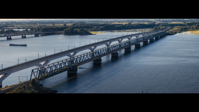 Video Reference: bridge, river, waterway, water, reflection, fixed link, sky, water resources, evening, channel