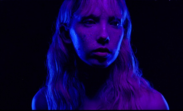 Video Reference: Face, Blue, Violet, Purple, Electric blue, Head, Light, Performance, Chin, Human