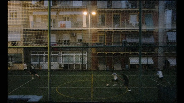 Video Reference: Net, Goal, Sport venue, Player, Grass, Team sport, Futsal, Competition event, Indoor soccer, Sports equipment
