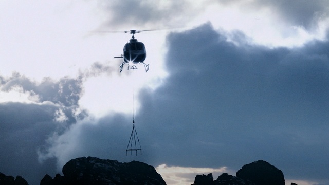 Video Reference: helicopter, sky, rotorcraft, cloud, geological phenomenon, mountain, mountain range, aircraft, terrain, meteorological phenomenon, Person