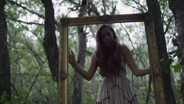 Video Reference: tree, woody plant, girl, forest, woodland, plant, grass, jungle, sunlight, old growth forest, Person