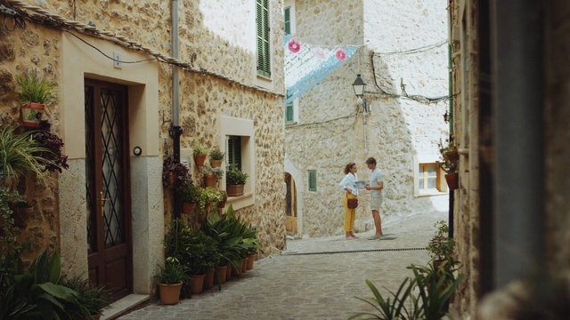 Video Reference: Street, Wall, Neighbourhood, Alley, Infrastructure, Building, Architecture, Road, Facade, Village, Person