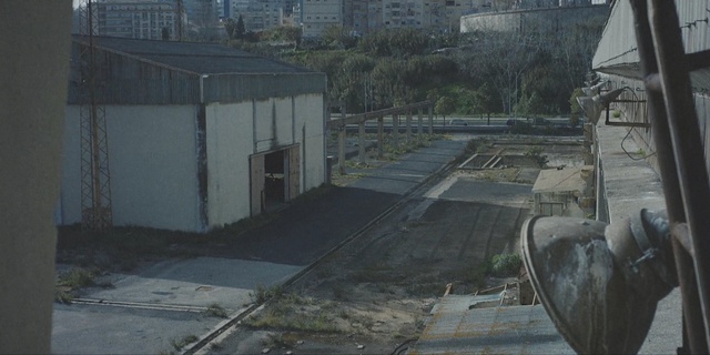 Video Reference: fence, wall, barrier, shopping cart, track, handcart, obstruction, road, landscape