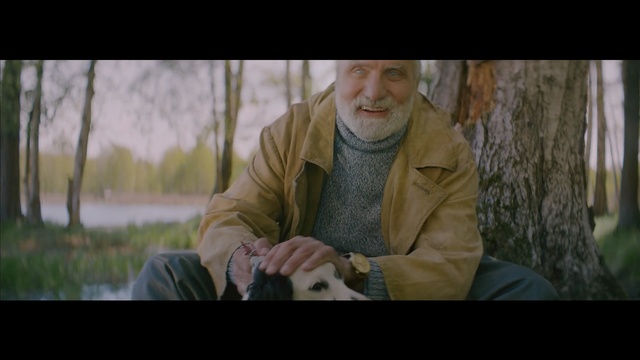 Video Reference: person, photography, sitting, screenshot, grass, human, human behavior, tree, sunlight, portrait
