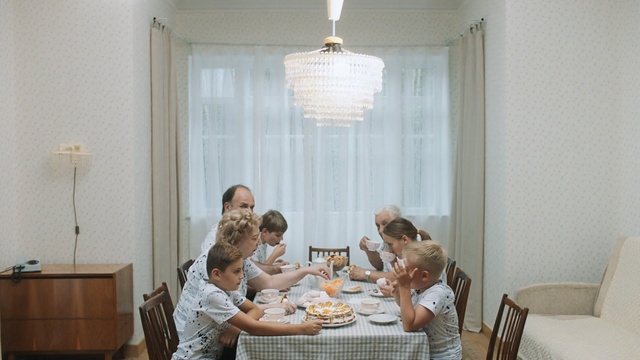Video Reference: White, Dining room, Room, Property, Table, Lighting, Interior design, Home, Chandelier, Window covering, Person