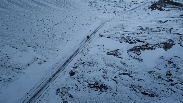 Video Reference: Winter, Snow, Geological phenomenon, Sky, Water, Tree, Freezing, Ice, Automotive tire, Auto part, Outdoor, Covered, Skiing, Man, Standing, Riding, Side, Walking, Field, Holding, Slope, Street, Hill, Red, Air, Group, Nature, Cold