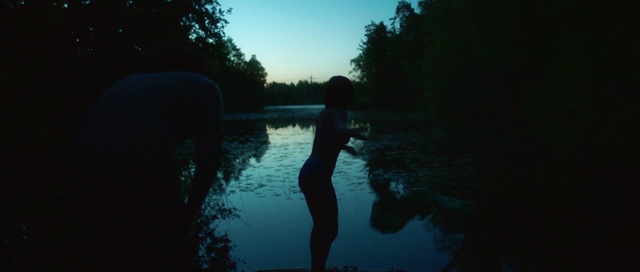 Video Reference: Water, Nature, Reflection, Blue, Sky, River, Light, Darkness, Tree, Morning, Outdoor, Person, Man, Sunset, Dark, Swimming, Sun, Standing, Holding, Riding, Boat, Cross, Lake, Body, Walking, Large, Hill, Street, Skiing, Water sport, Sport