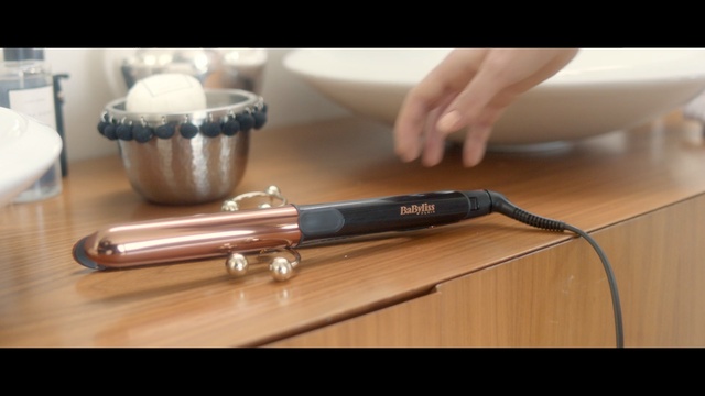 Video Reference: curling iron, table, hand, bathroom