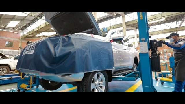 Video Reference: car, motor vehicle, vehicle, automotive design, automobile repair shop, automotive exterior, wheel, automotive wheel system, bumper, auto part