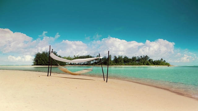 Video Reference: volleyball net, net, game equipment, beach, equipment, sand, sea, ocean, travel, water, vacation, island, coast, sky, landscape, tropical, sport, shore, holiday, paradise, summer, tourism, sun, relax, wave, Person