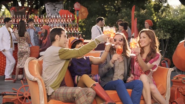 Video Reference: Smile, Shirt, Shorts, Facial expression, Orange, Happy, Hat, Yellow, Interaction, Entertainment