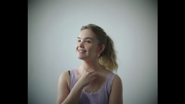 Video Reference: Hair, Smile, Arm, Flash photography, Happy, Gesture, Long hair, Fashion design, Electric blue, Event