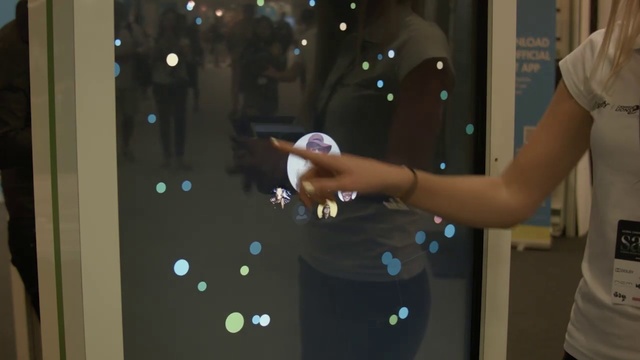 Video Reference: Hand, Technology, Electronic device, Display case, Space, Glass, Liquid bubble, Person