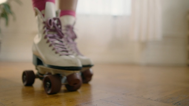 Video Reference: footwear, shoe, leg, flooring, floor, child, foot, wood, outdoor shoe, girl