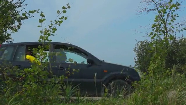 Video Reference: Vehicle, Car, Motor vehicle, Transport, Tree, Plant, Automotive exterior, Grass, Off-roading, Crossover suv, Person