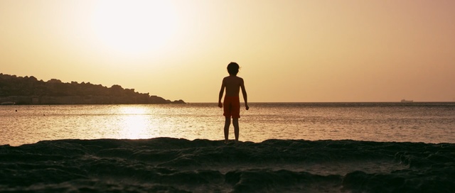 Video Reference: sea, body of water, water, sky, horizon, sun, sunset, sunrise, vacation, calm, Person