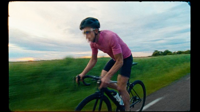 Video Reference: Cycling, Bicycle, Cycle sport, Bicycle helmet, Road cycling, Bicycles--equipment and supplies, Vehicle, Outdoor recreation, Road bicycle, Recreation, Grass, Outdoor, Riding, Man, Person, Board, Green, Young, Helmet, Hat, Wearing, Boy, Male, Street, Park, Water, Trick, Doing, Ocean, Sky, Skating, Sports equipment, Bicycle wheel, Land vehicle, Wheel, Bike, Transport, Rider, Bicycling