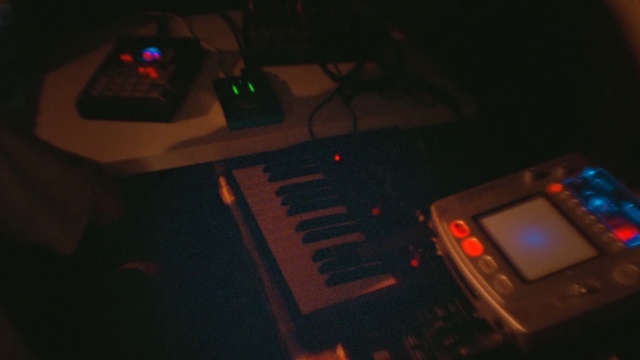 Video Reference: electronic instrument, disc jockey, light, darkness, entertainment, musical instrument accessory, musical instrument, electronic device, sound, technology